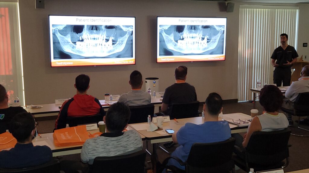 Picture of Dr. Ferrier lecturing in Providence, RI TeethXpress attendees.